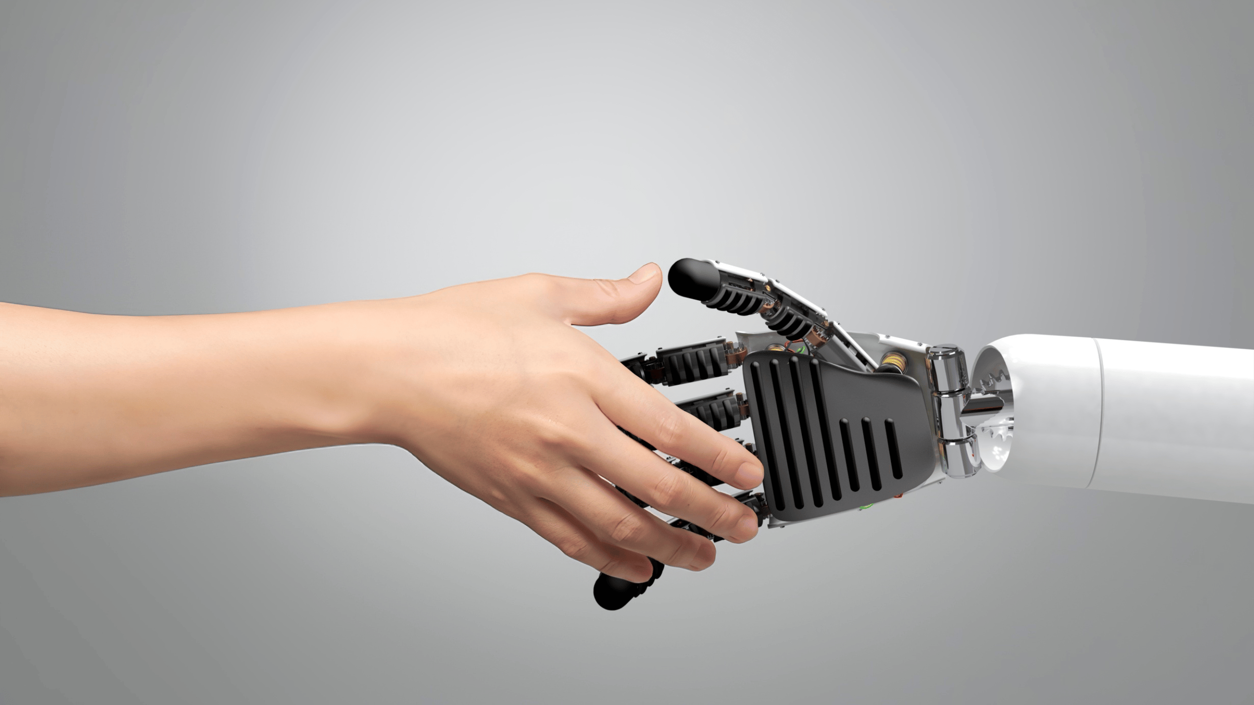 Menselijke hand schudt de robot hand, symboliseert de rol van AI in recruitment en de samenwerking tussen technologie en menselijke expertise.